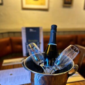 A bottle of prosecco in an iced bucket with two glasses. Afternoon tea at The British Oak, Mosborough Sheffield